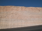 Uppermost Tuwaiq Miountain Formation showing an in-situ stromatoporoid-coral bioherm. A bed of nodular chert represents the deepest event. Dark beds represent the transgressiv e lagoon sediments.